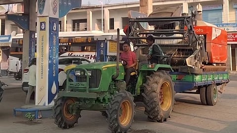 A harvester-laden tractor at a petrol pump in Sambalpur.
