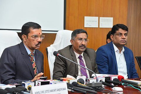 Justice Hanchate Sanjeev Kumar addressing in Chikkaballapur. Principal District and Sessions Judge T.P. Ramalingegowda and Deputy Commissioner G. Prabhu look on.
