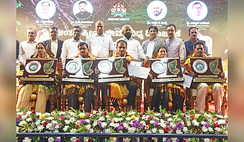 Forest Minister Eshwar Khandre felicitates awardees during the International Day for Biodiversity 2026 celebrations at Vidhana Soudha in Bengaluru.