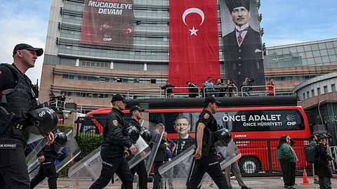 Police officers arrive at Turkey's main opposition Republican People's Party (CHP) headquarters in Ankara, Sunday, May 24, 2026, to evict supporters gathered inside. 
