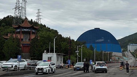 Police officers at a checkpoint stop cars at the entrance to the Liushenyu coal mine facility in Qinyuan county in Changzhi, northern China's Shanxi province on Sunday, May 24, 2026. 
