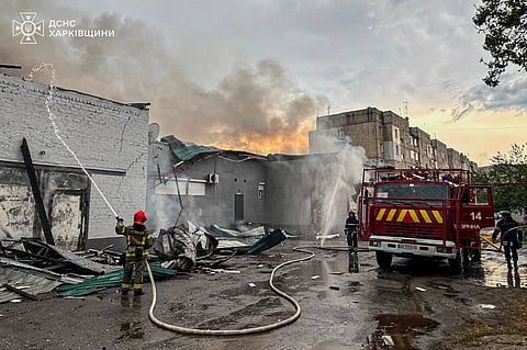 In this photo provided by the Ukrainian Emergency Service, firefighters put out the fire at a prayer house of a local Protestant community of Evangelical Christian Baptists following Russian air attack in Balakliia, Kharkiv region, Ukraine, Saturday, May 23, 2026.