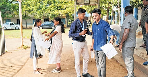 Aspirants being frisked at a UPSC examination centre at the Fatima Higher Secondary School in Puducherry on Sunday 