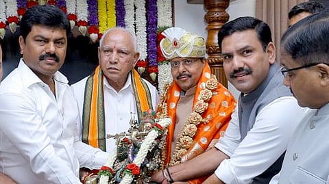 BJP National President Nitin Nabin being felicitated by senior leader BS Yeddiyurappa and his sons State BJP President BY Vijayendra and Shivamogga MP BY Raghavendra at their residence in Bengaluru on Sunday.