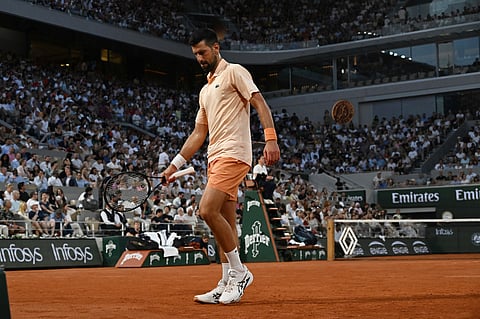 Novak Djokovic of Serbia returns to Giovanni Mpetshi Perricard of France during their first round men's singles tennis match at the French Open tennis tournament in Paris, Sunday, May 24, 2026.