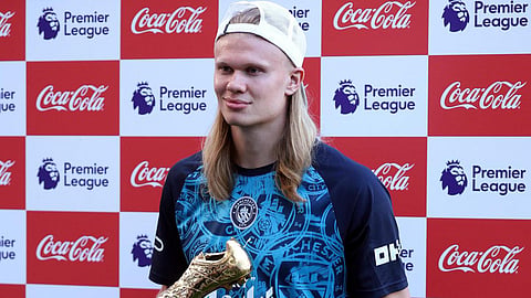 Manchester City's Erling Haaland poses with the Golden Boot Winner Trophy after the match between Manchester City vs Aston Villa. 
