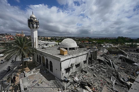 A damaged mosque is seen next of the destroyed Hezbollah paramedic center, right, which was hit in an Israeli airstrike on Tuesday in the village of Maashouk, southern Lebanon, Wednesday, May 20, 2026. 