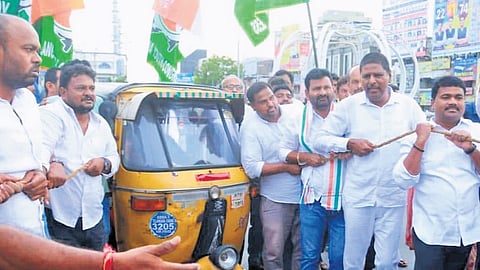 Congress leaders protest against the hike in diesel and petrol prices by pulling an autorickshaw at Choppadandi Chowrasta in Karimnagar on Monday. 