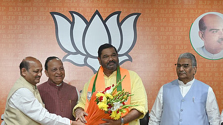 BJP National Secretary and Rajya Sabha MP Arun Singh and Odisha party President Manmohan Samal felicitates former BJD MP Debashish Samantaray