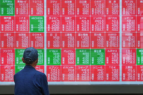 A person looks at an electronic stock board showing Japan's Nikkei index at a securities firm Monday, May 25, 2026, in Tokyo. 