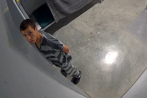 In this image from video provided by the Missouri State Highway Patrol, Immigration and Customs Enforcement detainee Brayan Rayo Garzon looks towards a surveillance camera in the Phelps County jail in Rolla, Mo., on April 7, 2025, shortly before he died by suicide.