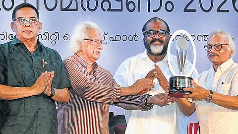 Filmmaker Adoor Gopalakrishnan presenting the ONV Literary Award to writer M Mukundan in Thiruvananthapuram on Wednesday. Poet Prabha Varma and Transport Minister C P John are also seen 