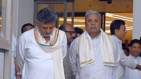 Karnataka Chief Minister Siddaramaiah, left, with Deputy Chief Minister DK Shivakumar at Indira Bhavan ahead of consultations with the Congress leadership, in New Delhi, Tuesday, May 26, 2026.