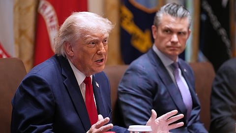 President Donald Trump speaks during a Cabinet meeting at the White House, Wednesday, May 27, 2026, in Washington, as Secretary of Defense Pete Hegseth, looks on.