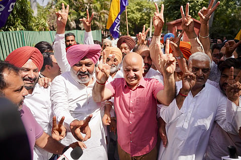 AAP leader Manish Sisodia celebrates after the party swept the civic body polls.
