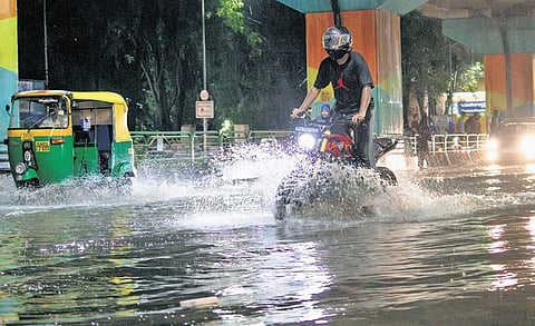 Motorists plough through waterlogged Jayadeva Junction 