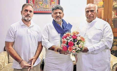 Congress President Mallikarjun Kharge and senior leader Rahul Gandhi being greeted by Karnataka Deputy CM D K Shivakumar, in New Delhi on Friday 