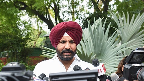 Punjab Congress President Amarinder Singh Raja Warring speaks to media as he arrives to attend meeting with Congress President Mallikarjun Kharge at his residence, in New Delhi on Friday.