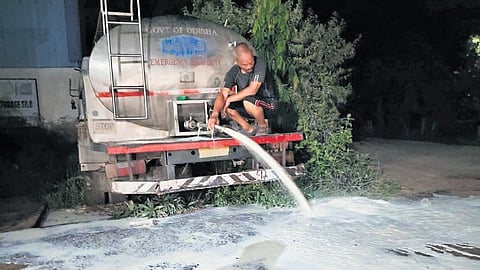 Farmers pouring milk on the street in Umerkote.