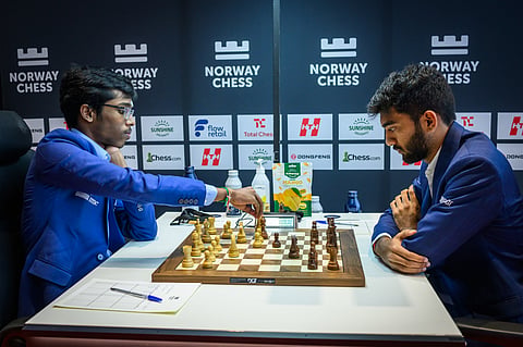 R Praggnanandhaa and D Gukesh at the board