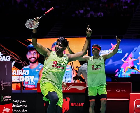 Satwiksairaj Rankireddy and Chirag Shetty (R) celebrate after clinching the Singapore Open crown on Sunday