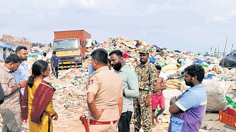 Civic officials, with the help of police, take into custody a vehicle used for illegally transporting and dumping solid waste near Siddartha Layout in Kadugodi.