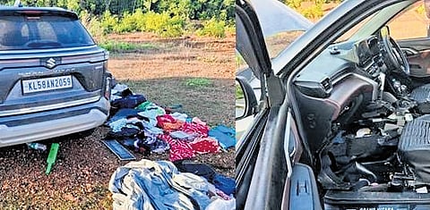 The stolen car that was found abandoned in a vacant plot near Pilathara Cooperative College. The belongings of the family are scattered near the vehicle. The inside of the car has been severely damaged (R)