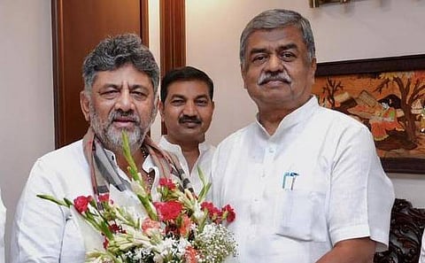 Congress leader BK Hariprasad greets CM-designate DK Shivakumar in New Delhi on Monday.