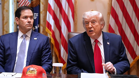 President Donald Trump, next to Secretary of State Marco Rubio.
