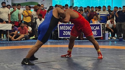 A wrestling bout in progress during the men's selection trials held at SAI centre, Lucknow on Sunday