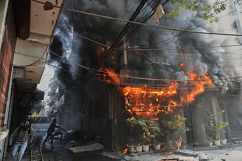 A licensed six-room B&B allegedly operated over two dozen rooms without a fire NOC, while trapped guests battled smoke, flames and blocked escape routes.