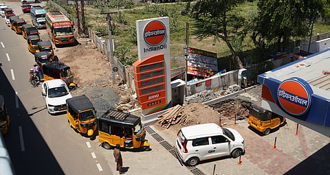 Vehicles waiting in a long queue to fill fuel at a bunk in Madurai.