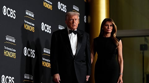 US President Donald Trump and first lady Melania Trump walk the red carpet before the 48th Kennedy Center Honours, Dec. 7, 2025, at the John F. Kennedy Center for the Performing Arts in Washington.