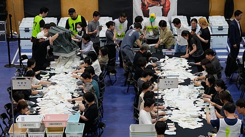 Election Commission officials prepare ballots for counting at the local elections at a gymnasium in Seoul, South Korea, Wednesday, June 3, 2026.