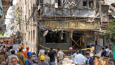 Police and firefighters at the site after a fire broke out at a bed-and-breakfast in a five-storey building in south Delhis Malviya Nagar area, Wednesday, June 3, 2026. At least 21 killed and several were injured in the incident.