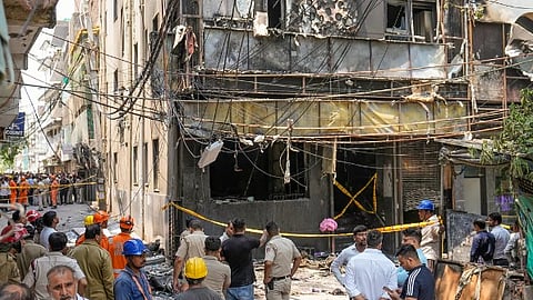 Police and firefighters at the site after a fire broke out at a bed-and-breakfast in a five-storey building in south Delhis Malviya Nagar area, Wednesday, June 3, 2026. At least 21 killed and several were injured in the incident.