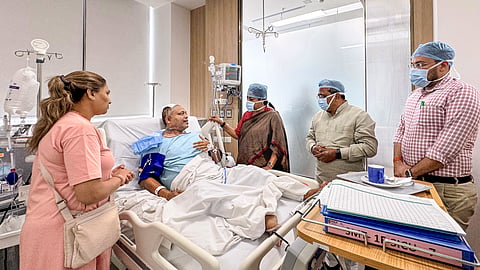 Delhi Chief Minister Rekha Gupta meets a person injured in the Malviya Nagar fire incident, which claimed the lives of 21 people, at Max Hospital, Saket, in New Delhi, Thursday, June 4, 2026.