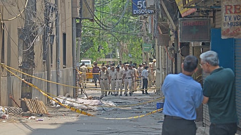 An eerie silence hangs over the area a day after a devastating blaze at the hotel snuffed out 21 lives in the Malviya Nagar area.