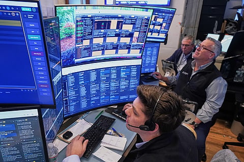 A trio of traders work on the floor of the New York Stock Exchange, Wednesday, June 3, 2026.