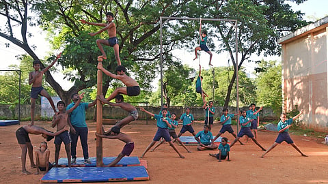 Boys and girls getting training in Mallar Kambam at Anna Stadium in Tiruchy on Tuesday.