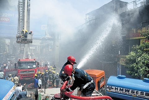 Preliminary findings suggest sparks from chimneys connected to a nearby mess may have contributed to the blaze, though a short circuit is also being examined.