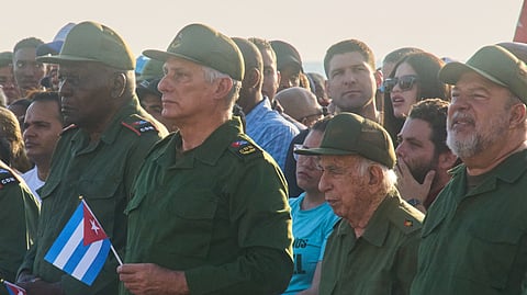 Cuba's President Miguel Diaz-Canel, second left, and Raul Castro's grandson Raul Guillermo Rodriguez Castro, center back, take part in a rally in support of former President Raul Castro in front of the U.S. Embassy in Havana, Cuba, Friday, May 22, 2026, after U.S. prosecutors filed an indictment accusing him of ordering the 1996 shootdown of civilian planes flown by Miami-based exiles.