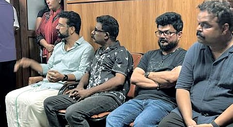MLA Ramesh Pisharody with director Nadirshah waiting to pay last respects to Salim Kumar in Kochi on Saturday night.