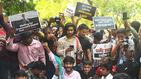 Cockroach Janta Party (CJP) supporters during a protest demanding the resignation of Union Education Minister Dharmendra Pradhan over alleged examination-related lapses at the Jantar Mantar in New Delhi, Saturday, June 6, 2026.
