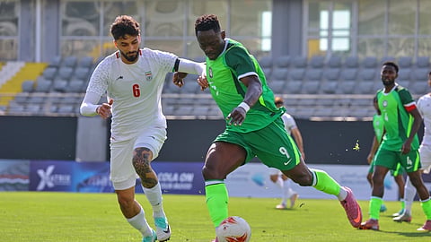 Nigeria's Akor Adams, right, fights for the ball with Iran's Mohammad Ghorbani during a friendly soccer match between Iran and Nigeria in Antalya, southern Turkey, March 27, 2026.