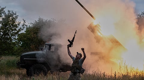 In this photo provided by Ukraine's 93rd Kholodnyi Yar Separate Mechanized Brigade press service, a soldier reacts as an MRLS BM-21 "Grad" fires at the Russian positions near Kostiantynivka, Donetsk region, Ukraine, Thursday, June 4, 2026.