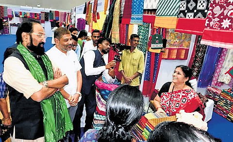 Civil Supplies Minister N Uttam Kumar Reddy visits stalls and interacts with weavers at the Thread Pochampally exhibition at HITEX, Hyderabad, on Saturday