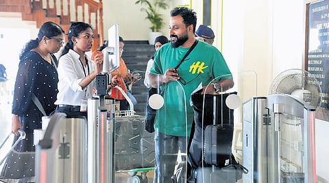 A passenger accessing Digiyatra facility at Kochi airport | express