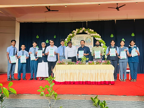 The school authorities launching the digital platform to estimate the carbon emissions produced by their daily life, on the World Environment Day