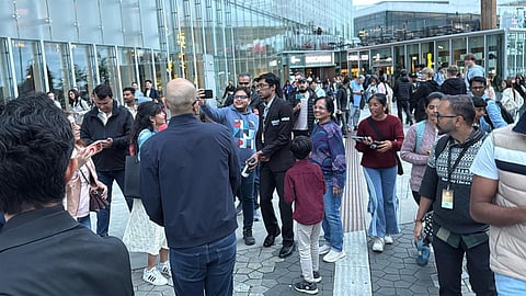 R Praggnanandhaa (c) next to the Deichman Bjorvika in Oslo on Friday